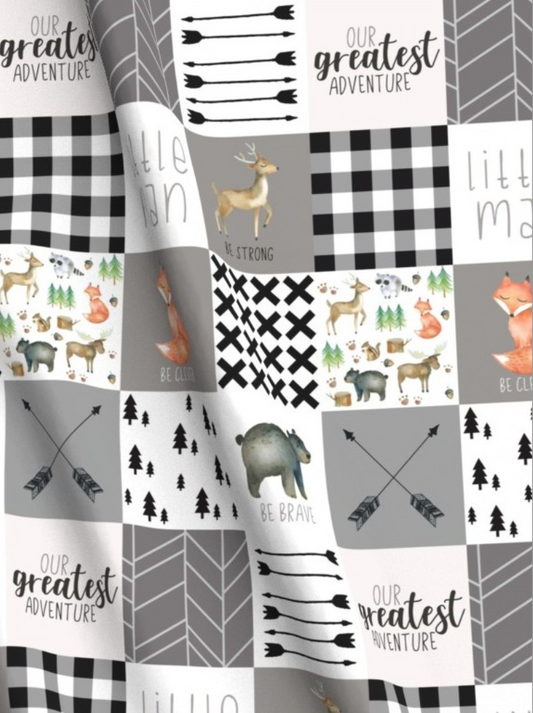 Patterned fabric with arrows, animals, and text on a checkered background