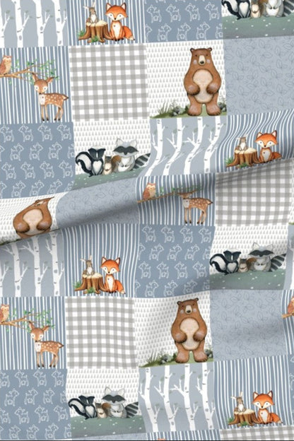Dainty Deer Woodland Blue minky fabric — patchwork squares of deer, bears, foxes, racoons and birch trees with blue-grey gingham, stripes and leaf panels