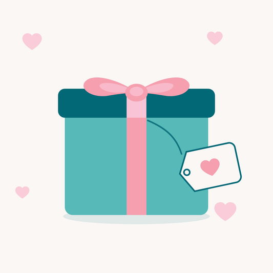 Teal gift box with a pink ribbon and bow and a heart gift tag