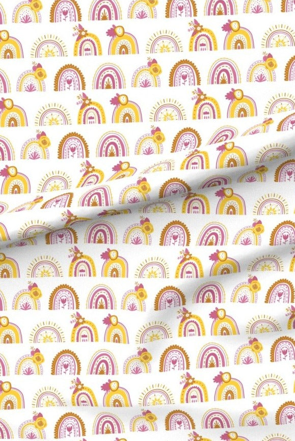 Pink Rainbows premium minky fabric — rows of little rainbows in pink, mustard and terracotta on white