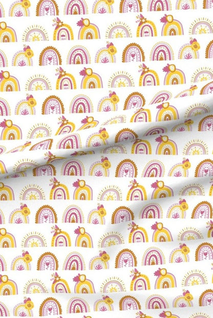 Pink Rainbows premium minky fabric — rows of little rainbows in pink, mustard and terracotta on white