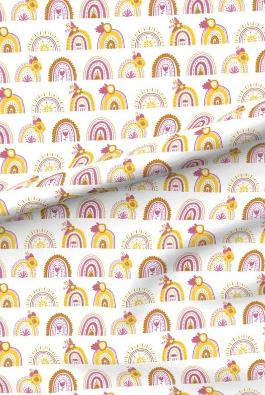 Pink Rainbows premium minky fabric — rows of little rainbows in pink, mustard and terracotta on white