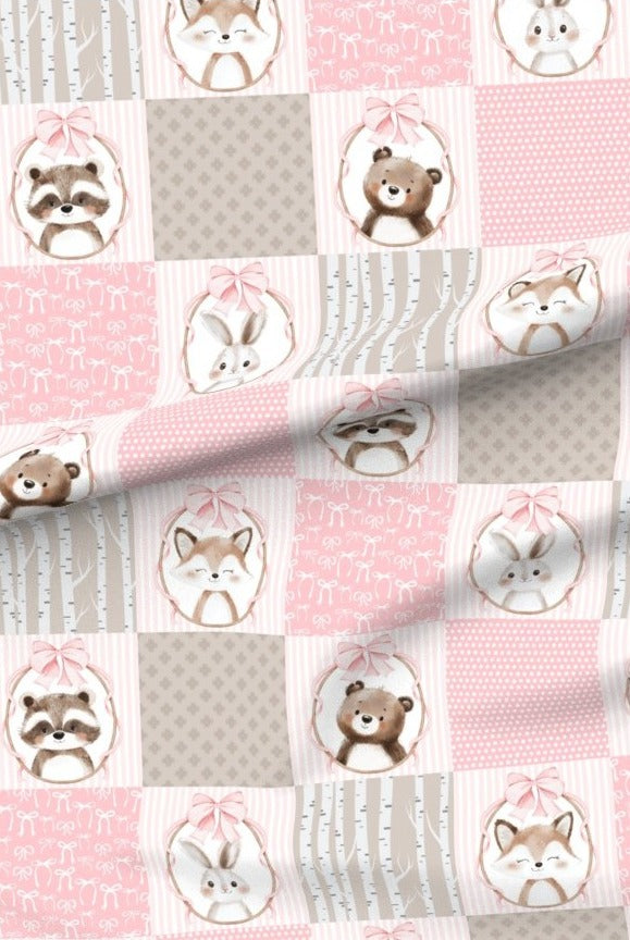 Pink Woodland Animals premium minky fabric — bears, foxes, racoons and bunnies in patchwork squares of soft pink and grey