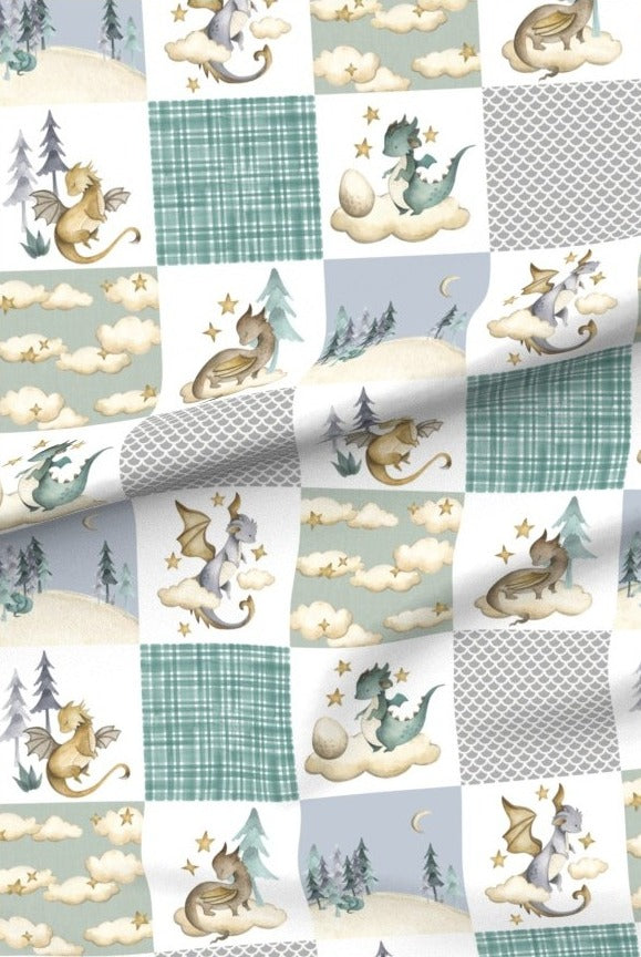 Soft Dragons premium minky fabric — friendly dragons, clouds and pine trees in patchwork squares of sage green and cream